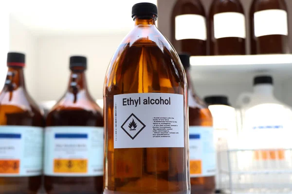 Ethyl alcohol in glass,Hazardous chemicals and symbols on containers in industry or laboratory