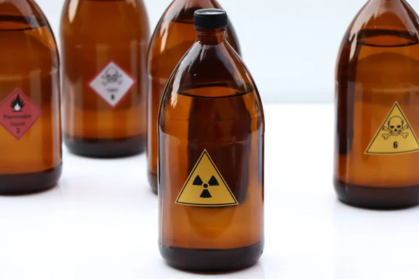 Radioactivity symbol on bottle chemical ,warning symbol, chemical in laboratory and industry