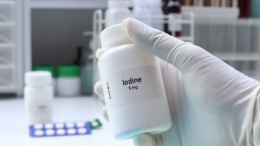Lodine hapı beyaz şişede, hap stoku, tıbbi veya eczane konsepti