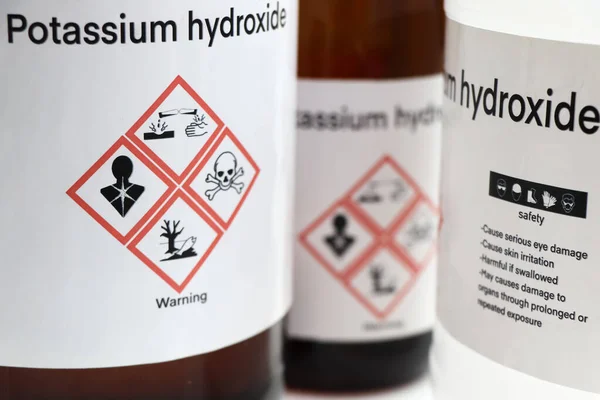 Potassium hydroxide, Hazardous chemicals and symbols on containers, chemical in industry or laboratory