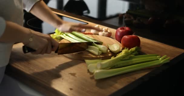 Video Close Cropped Female Hands Chopping Fresh Celery Wooden Kitchen — Stock Video
