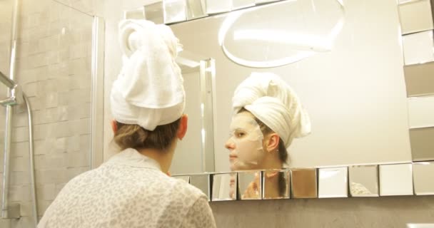 Concentrated Young Woman Stand Bathroom Hair Wrapped Towel Looking Reflection — Wideo stockowe