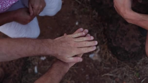 Video Unrecognizable People Hands Put Palms Each Other Ground Group — Stock Video