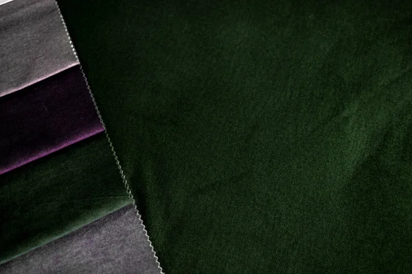 Luxurious dark green velvet and its companion colors. Collection of fabrics. Furniture and curtain velvet fabrics. Natural materials. Interior design. Sewing curtains , Upholstery. Classic style. High