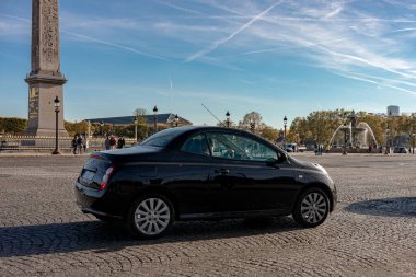 cosy Paris street with view on the famous Eiffel Tower on a cloudy summer day, Paris France, toned. High quality photo
