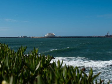 View over Atlantic ocean towards Matosinhos passenger port in Porto, Portugal. clipart