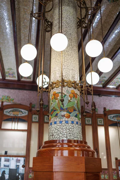 stock image Detail of an Ornate Column and Lights inside the Building of Valencia North Station in Valencia, Spain.