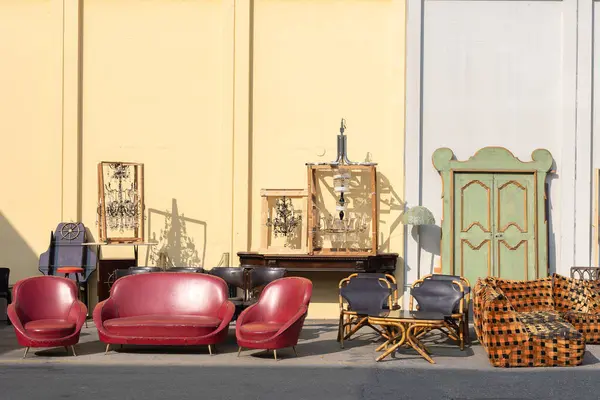 Antique Wooden Stuffed - Furniture, Cabinets, Sofas, Chairs and Mirrors Leaning Outside on the Street.