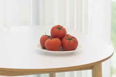 blanched tomatoes on white plate clipart