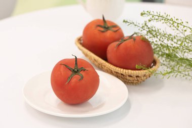 blanched tomatoes on white plate clipart