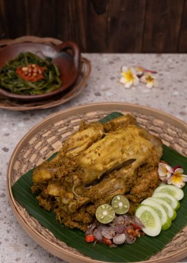 Balinese Indonesian food named Ayam Betutu. Served with traditional sambals and roasted peanuts. Top View clipart