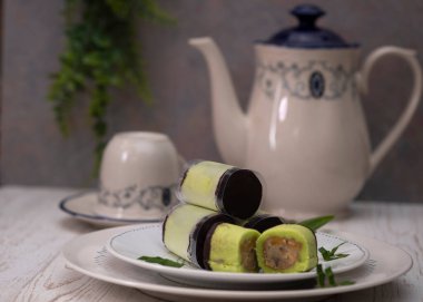 Choco banana roll cake. A famous snacks for tea time from Bandung, Indonesia. Selective Focus. Close Up clipart