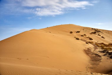 Singing dune in the Altyn Emel National Park, Kazakhstan. a natural landmark. clipart