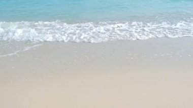 A wave of the sea on the sand beach.