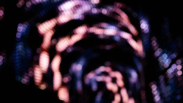 Pink and violet bokeh on a dark background.