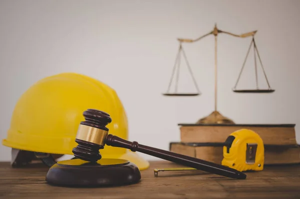 Judge\'s hammer and helmet Law and Justice about labor law concept Construction law.