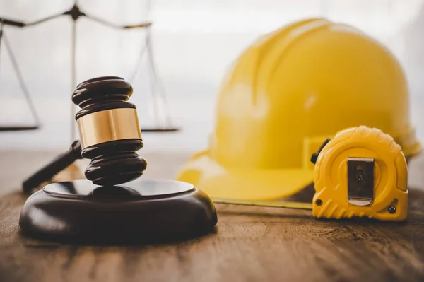 Judge\'s hammer and helmet Law and Justice about labor law concept Construction law.