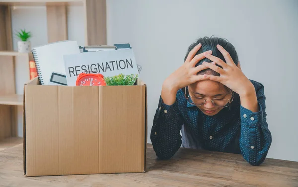 Female company employee stressed and fed up after quitting her job to look for a new job, fired or was fired by the employer