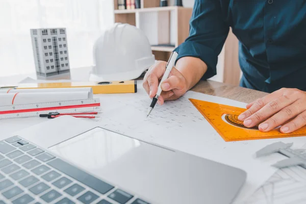 stock image engineer working in office with blueprints, inspection in workplace for architectural plan, construction project ,Business construction