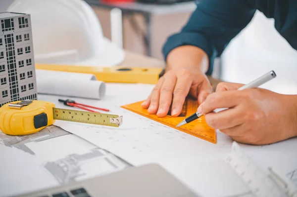 stock image engineer working in office with blueprints, inspection in workplace for architectural plan, construction project ,Business construction