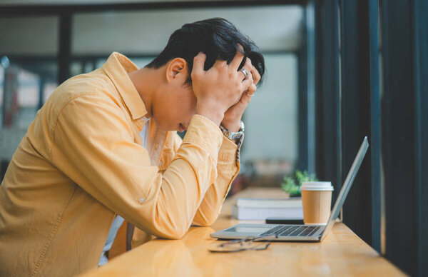 College students feel tired, headache and sleepy. After having to work or study online via laptop for a long time