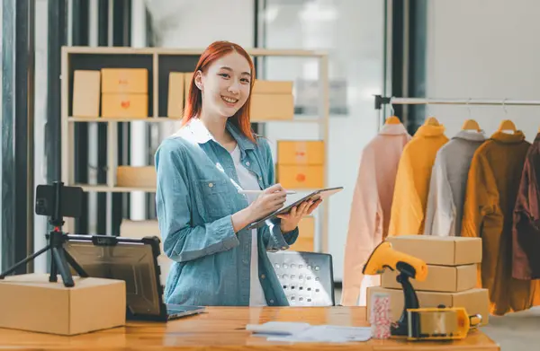 Portrait of young business asian woman online smiling happily at work,Success business people employee,  SME online marketing