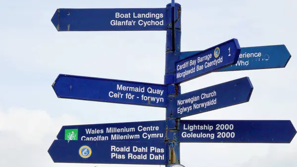 stock image Cardiff Bay, Cardiff, Wales Sept 25 2023: Street signpost giving directions to some of Cardiff's most popular landmark attractions.