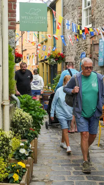 Stock image Tenby, Pembrokeshire Wales July 02 2024. Sergeant's Lane, a narrow, winding thoroughfare used historically for defensive and transport purposes. Now houses  busy and popular bars and a brewery. 