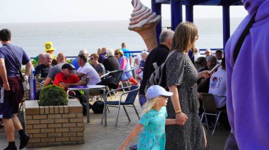 Barry Island, Vale of Glam, Wales, Aug 30 2024: The announcement of a Christmas special and finale of the Gavin and Stacey series renews interest from fan in the infamous Marco's Cafe and Barry Island clipart