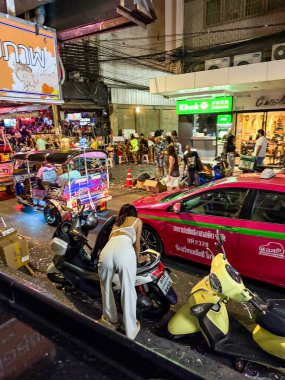 Bangkok, Thailand, January 2nd 2025: Bangkok nightlife. Lively atmospheric noisy streets full of vibrant light and colour. Travellers, tourists and locals enjoy celebrating the new year together.