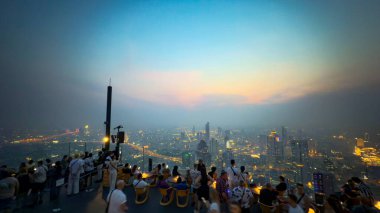 Bangkok, Thailand, 18 Jan 2025: Thailands tallest observatory deck at the Mahanakhon SkyWalk in Bangkok. The roof top bar stands at 314 m with spectacular views attract visitors of all nationalities clipart