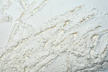 Beyaz unun arka plan dokusu çatlaklı bir duvar şeklinde. Tasarım için arkaplan.