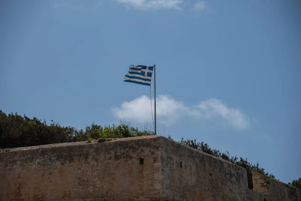 stock image A Greek flag flies on top of a fortress