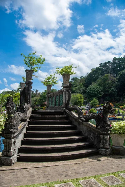 stock image Bridge with Balinese stone sculptures in the water palace 