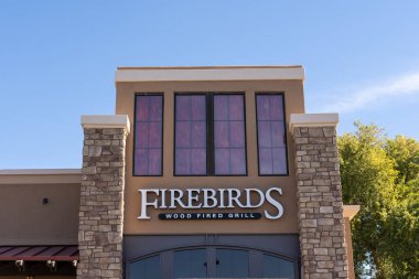 Chandler, AZ - Nov. 23, 2022: Firebirds Wood Fired Grill specializes in classic American cuisine prepared over a wood-fired grill.
