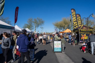 Gilbert, AZ - Nov. 26, 2022: Families shopping at the Gilbert Farmers Market, held every Saturday year round.