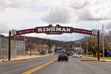Kingman, AZ - March 11, 2023: Welcome to Kingman archway over the road as you enter town. Kingman is known as the heart of Historic Route 66. clipart