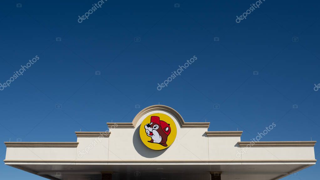 Terrell, TX - Oct. 16, 2023: The Buc-ee's logo is a beaver head in a yellow circle. Buc-ee's is a US chain of travel centers with a convenience store and gas station. Some have Tesla Superchargers.