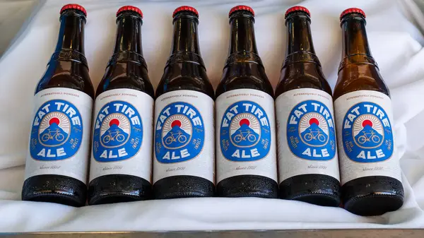 stock image Nassau, Bahamas - April 9, 2024: Display with cold bottles of Fat Tire Ale. In 2020, Fat Tire became Americas first certified carbon neutral beer.