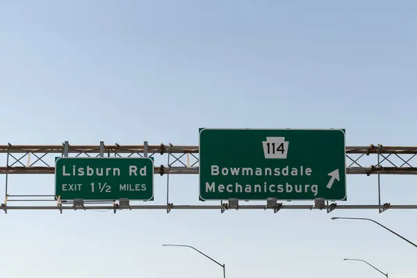 stock image exit signs on US-15 for PA-114 toward Bowmansdale and Mechanicsburg or Lisburn Road