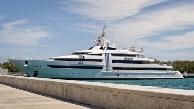 Nassau, Bahamas - April 9, 2024: Vibrant Curiosity is a mega yacht, owned by German entrepreneur Reinhold Wurth. The yacht was named for Wurth company's motto in the 2006-2007 business year. clipart