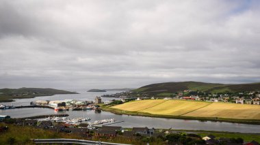 Looking down on the East Voe of Scalloway and Scalloway Harbor, with Scalloway Castle in Shetland, Scotland, United Kingdom clipart