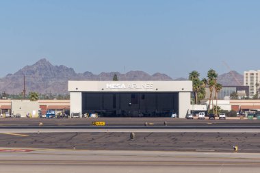 Phoenix, Arizona - Dec. 3, 2024: Mesa Airlines provides regional air service by operating flights on behalf of United Airlines under the United Express brand. clipart