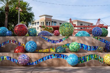 Scottsdale, AZ - Nov. 26, 2024: Pinball Wizard by Annette Coleman is in Old Town Scottsdale at Stetson Plaza. The sculpture features one inch hand cut stained glass tiles on twenty-eight spheres. clipart