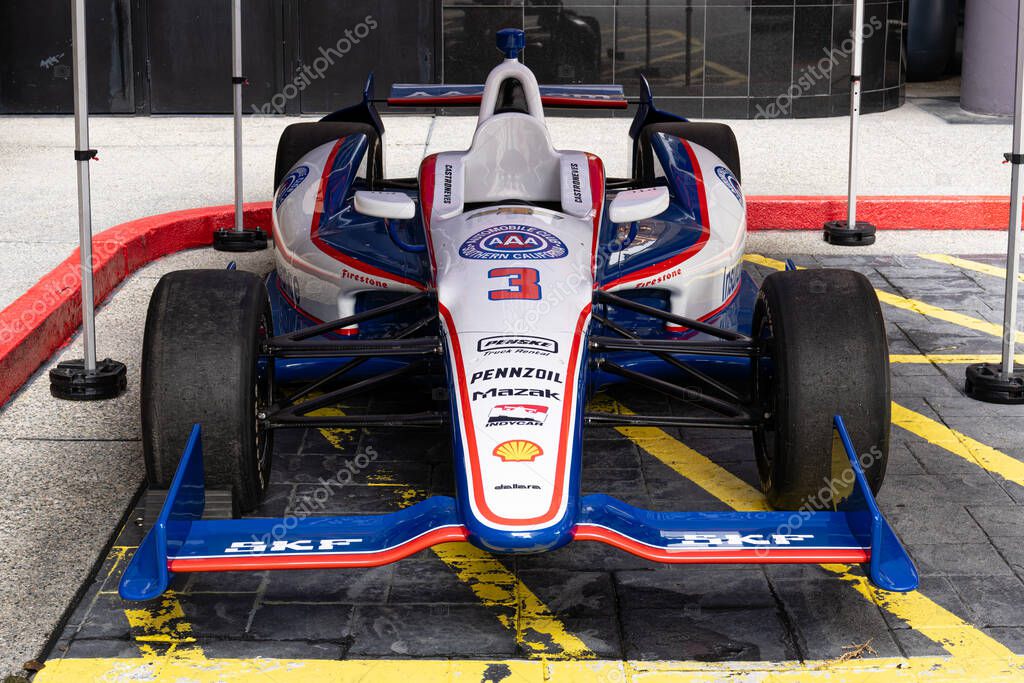 Long Beach, CA - March 13, 2025: Helio Castroneves's IndyCar #3 on display outside the Marriott Long Beach Downtown.
