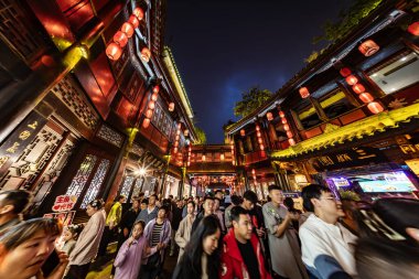 Chengdu, China - May 2024: Crowds at the bustling Jinli Pedestrian Street in Chengdu, Sichuan. clipart