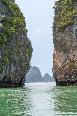 Small passage between two islets in Ha Long Bay, Quang Ninh, Vietnam. clipart