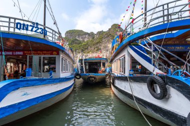 Ha Long Bay, Vietnam - 28 Apr 2024: Boats arriving at Surprise Grotto aka Hang Sung Sot in Ha Long Bay, Quang Ninh, Vietnam. clipart