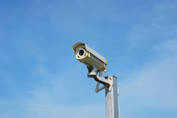 Closed circuit camera or CCTV camera outdoor with sunny and blue sky