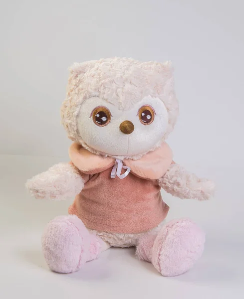 Soft plush toy cat for children on a white background.